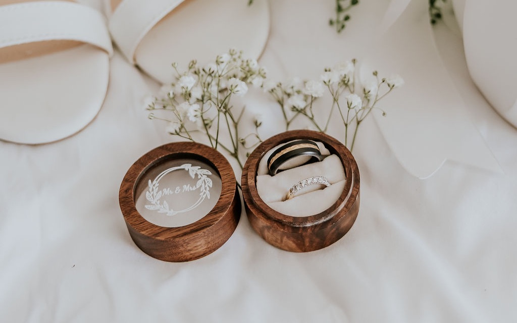Wedding rings in their wooden boxes